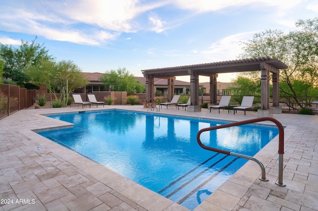 view of pool featuring a pergola and a patio