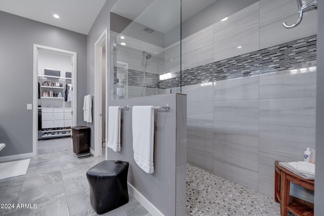 bathroom with tiled shower