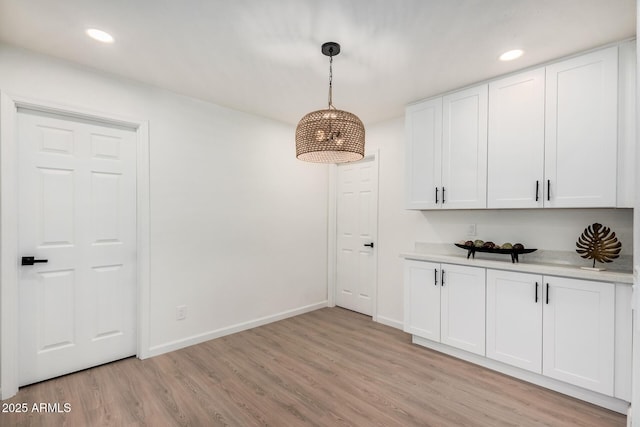 unfurnished dining area featuring light hardwood / wood-style flooring