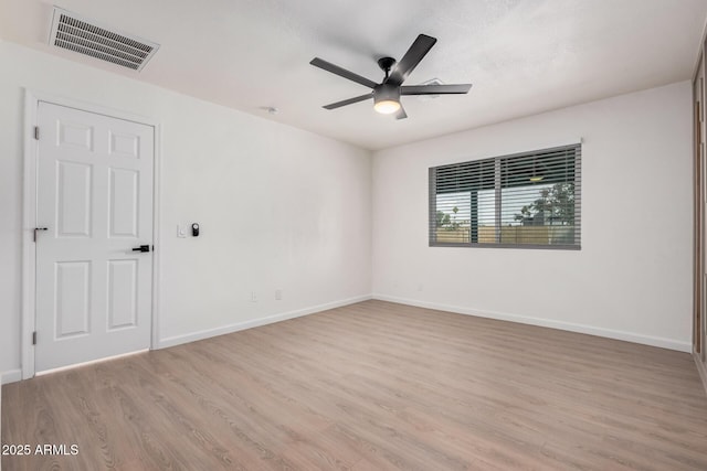 empty room with ceiling fan and light wood-type flooring