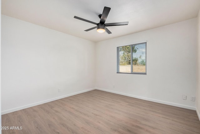 spare room featuring ceiling fan and light hardwood / wood-style floors