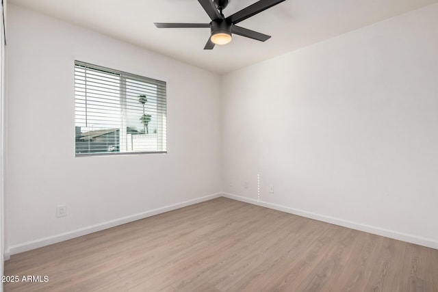 spare room with light hardwood / wood-style floors and ceiling fan