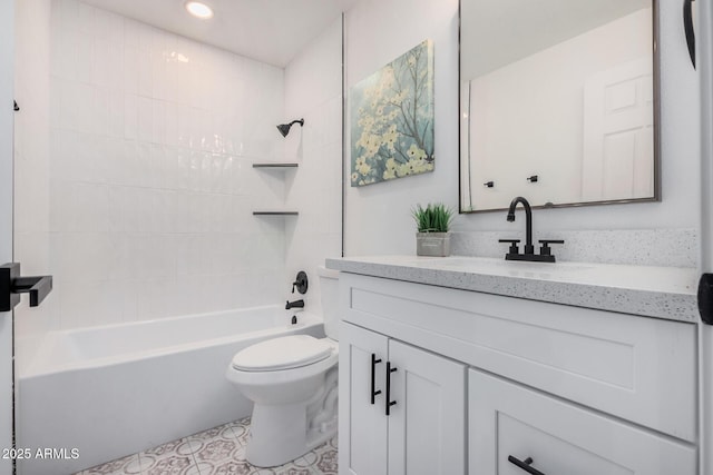 full bathroom with vanity, toilet, and tiled shower / bath