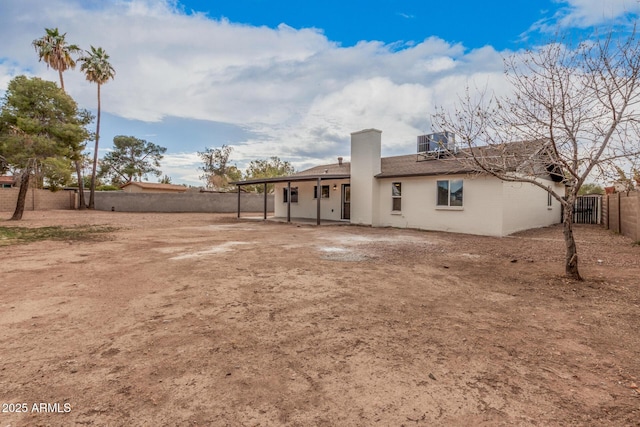 back of house featuring cooling unit and a patio