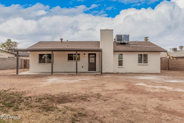 rear view of house with a patio area and central air condition unit