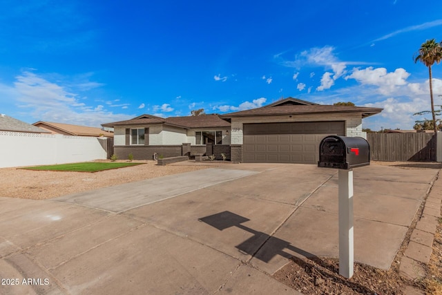 ranch-style home featuring a garage