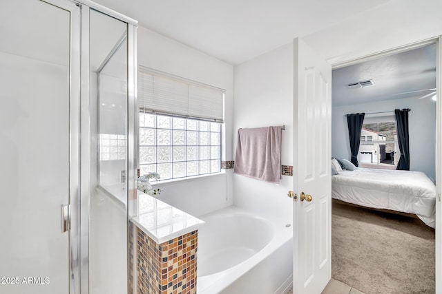 450 W Mountain Sage Dr, Phoenix, AZ 85045 - ensuite bathroom featuring a bath and a stall shower