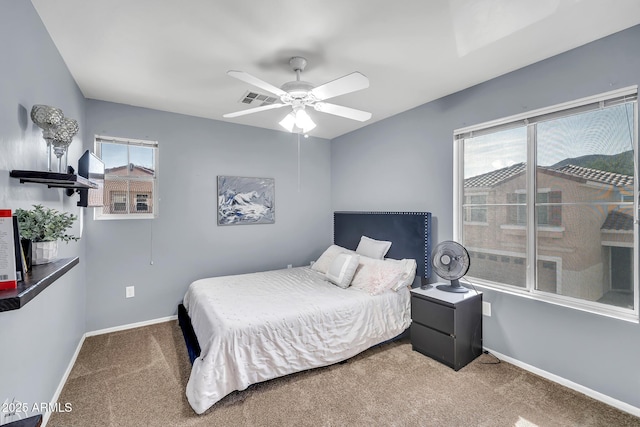 450 W Mountain Sage Dr, Phoenix, AZ 85045 - carpeted bedroom featuring baseboards and a ceiling fan