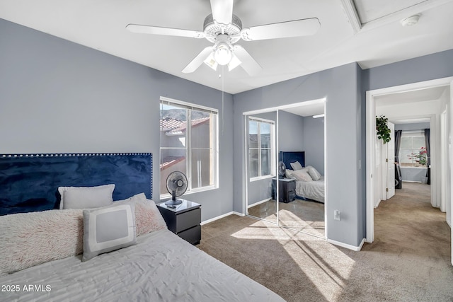 450 W Mountain Sage Dr, Phoenix, AZ 85045 - carpeted bedroom with baseboards, a closet, and a ceiling fan