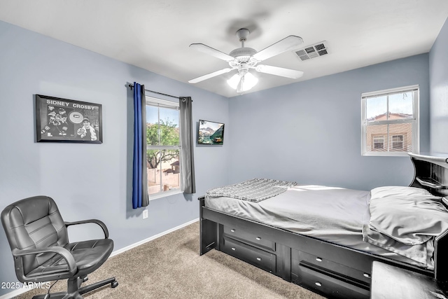 450 W Mountain Sage Dr, Phoenix, AZ 85045 - carpeted bedroom with multiple windows, baseboards, and ceiling fan