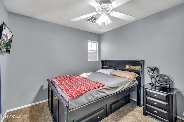 450 W Mountain Sage Dr, Phoenix, AZ 85045 - carpeted bedroom with baseboards and a ceiling fan