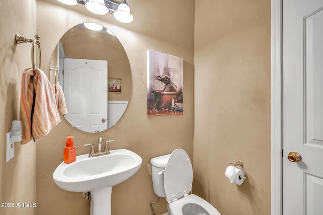 450 W Mountain Sage Dr, Phoenix, AZ 85045 - half bathroom featuring toilet and a sink