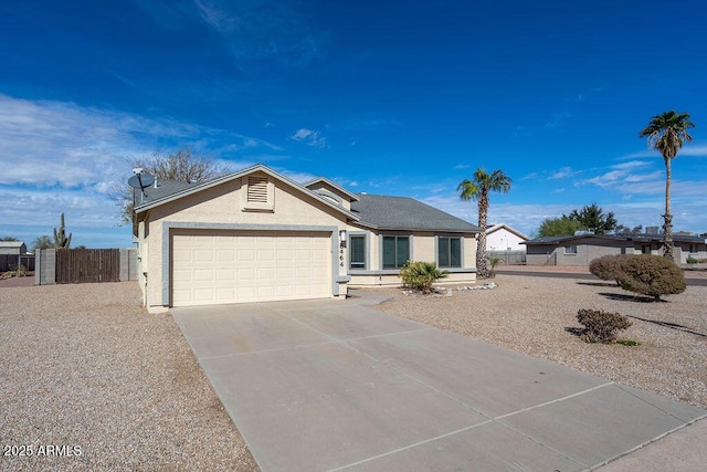 ranch-style home featuring a garage