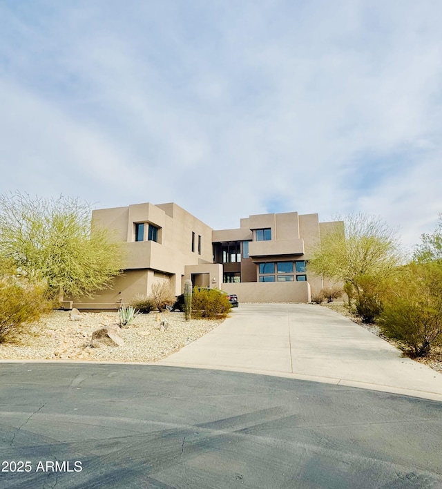 view of front of house featuring stucco siding