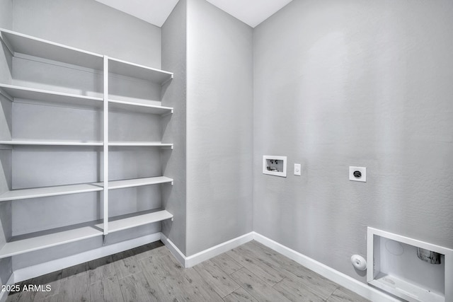 washroom with washer hookup, hardwood / wood-style floors, gas dryer hookup, and hookup for an electric dryer