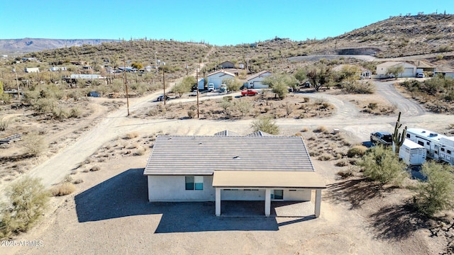 birds eye view of property featuring a mountain view