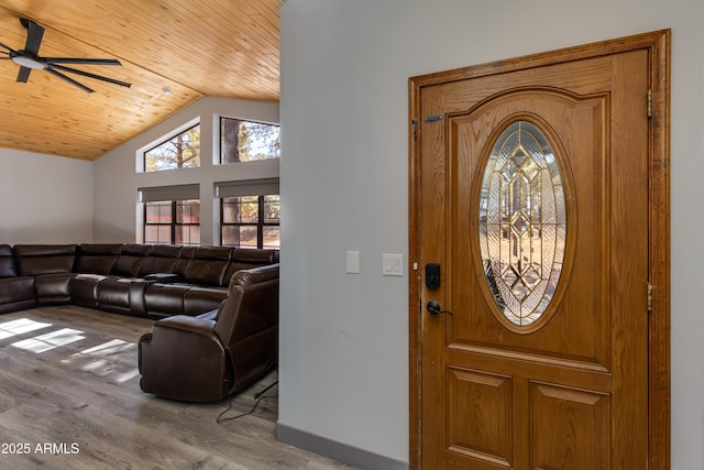 foyer with hardwood / wood-style flooring, ceiling fan, lofted ceiling, and wood ceiling