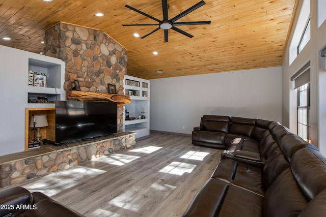 living room featuring wood-type flooring, a fireplace, wood ceiling, and built in shelves