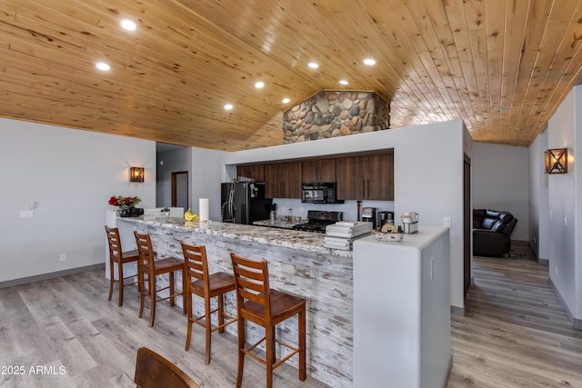 kitchen featuring wood ceiling, black appliances, kitchen peninsula, and light wood-type flooring