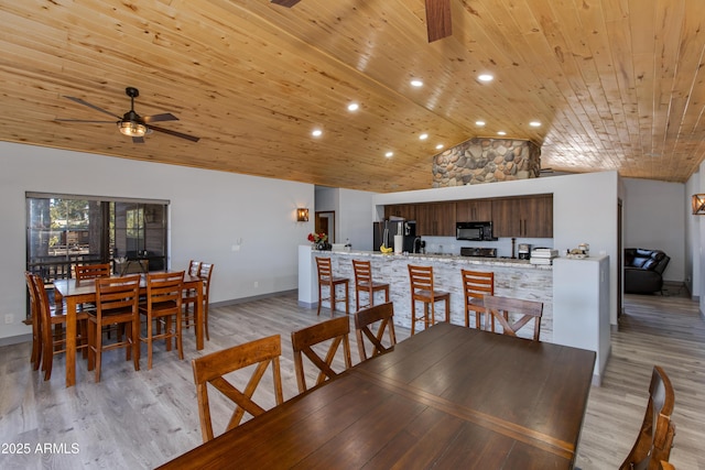 dining area featuring wood ceiling, ceiling fan, high vaulted ceiling, and light hardwood / wood-style flooring