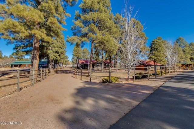 surrounding community featuring a rural view and an outbuilding