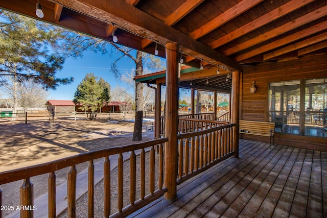 wooden deck with an outbuilding