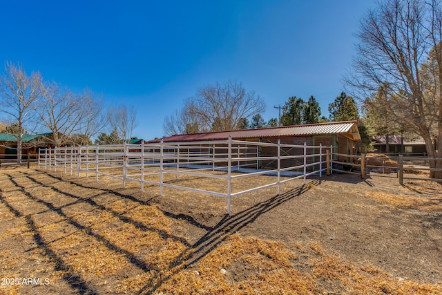 view of stable featuring a rural view