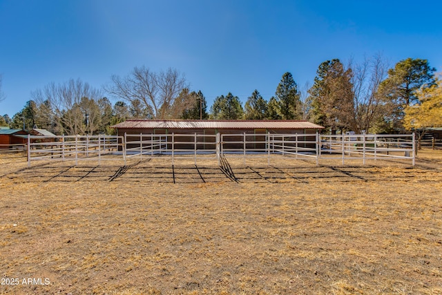 view of horse barn featuring a rural view