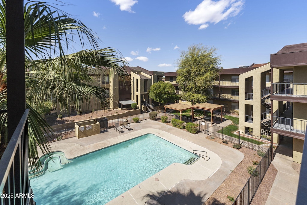 pool with a patio area, a gazebo, and fence