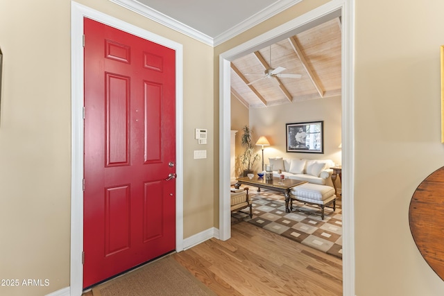 entryway featuring vaulted ceiling with beams, ceiling fan, light hardwood / wood-style floors, and wooden ceiling