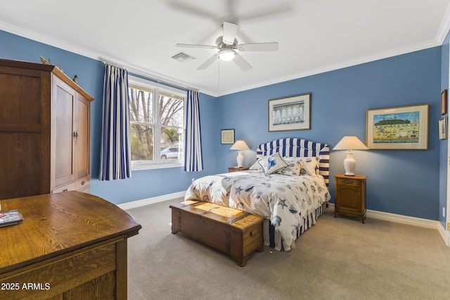 carpeted bedroom with ceiling fan and ornamental molding