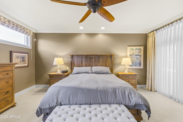 carpeted bedroom with ceiling fan and crown molding