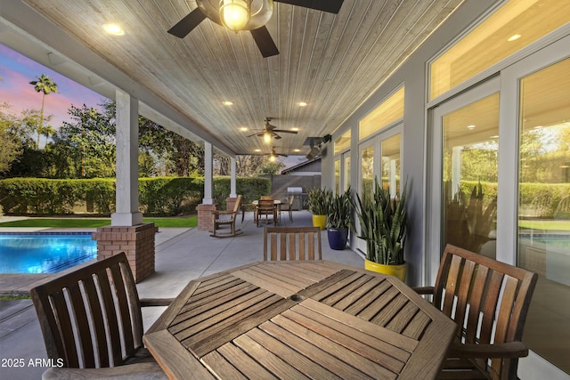 view of patio terrace at dusk