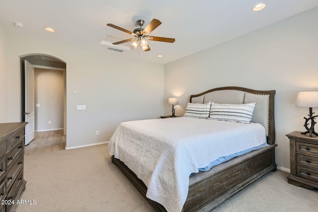 bedroom featuring ceiling fan and light colored carpet