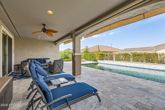 view of patio / terrace featuring a fenced in pool, an outdoor hangout area, and ceiling fan