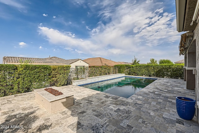 view of swimming pool with a patio