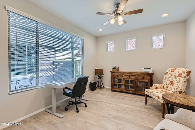 office featuring light wood-type flooring and ceiling fan