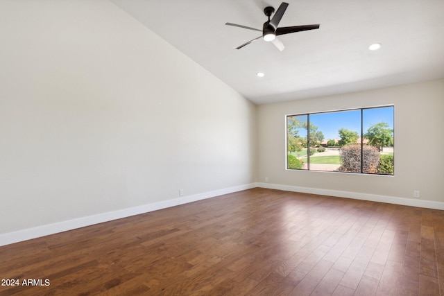 empty room featuring baseboards, a ceiling fan, dark wood-style floors, recessed lighting, and lofted ceiling