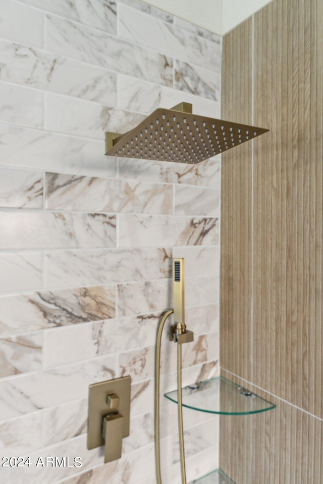 bathroom with a tile shower