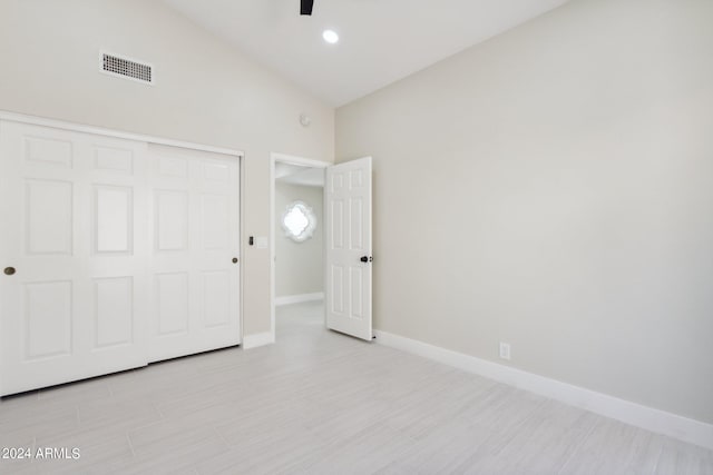 unfurnished bedroom with a closet, visible vents, baseboards, and ceiling fan