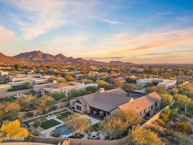 aerial view at dusk with a mountain view