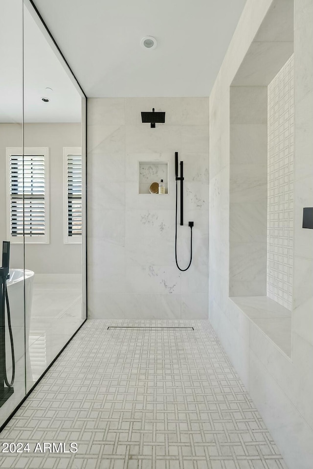 bathroom with tiled shower