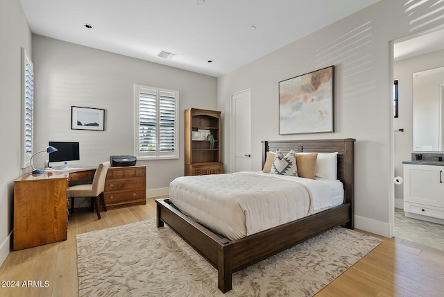 bedroom with light wood-type flooring