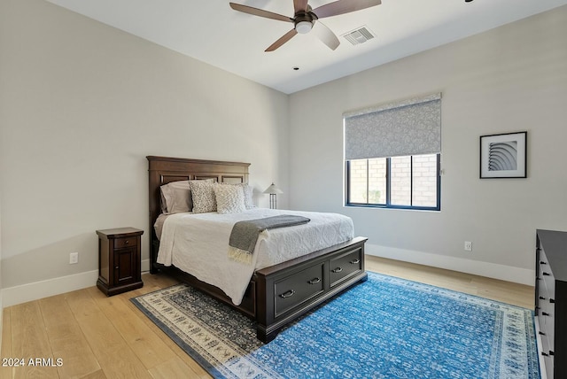 bedroom featuring ceiling fan and light hardwood / wood-style floors