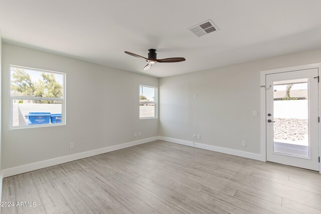 bathroom with toilet, vanity, an enclosed shower, and hardwood / wood-style floors