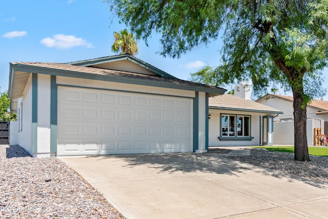 single story home featuring a garage