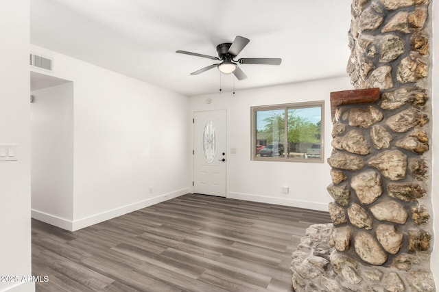 foyer with baseboards, ceiling fan, and wood finished floors