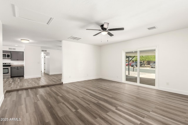 unfurnished living room with baseboards, ceiling fan, wood finished floors, and visible vents