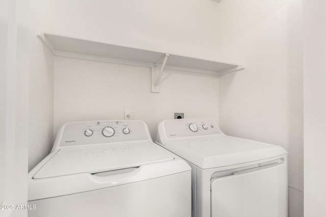 clothes washing area with laundry area and washing machine and clothes dryer