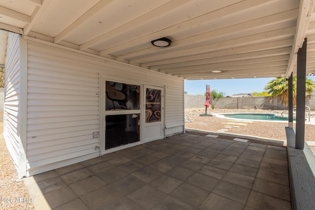 view of patio with a fenced in pool and a fenced backyard